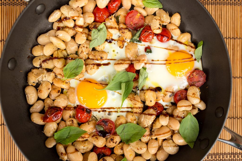 Beans and egg in a pan
