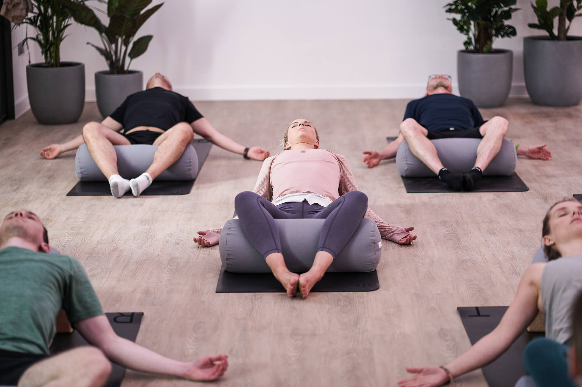 yoga rest - yogi lay on yoga mat in resting position